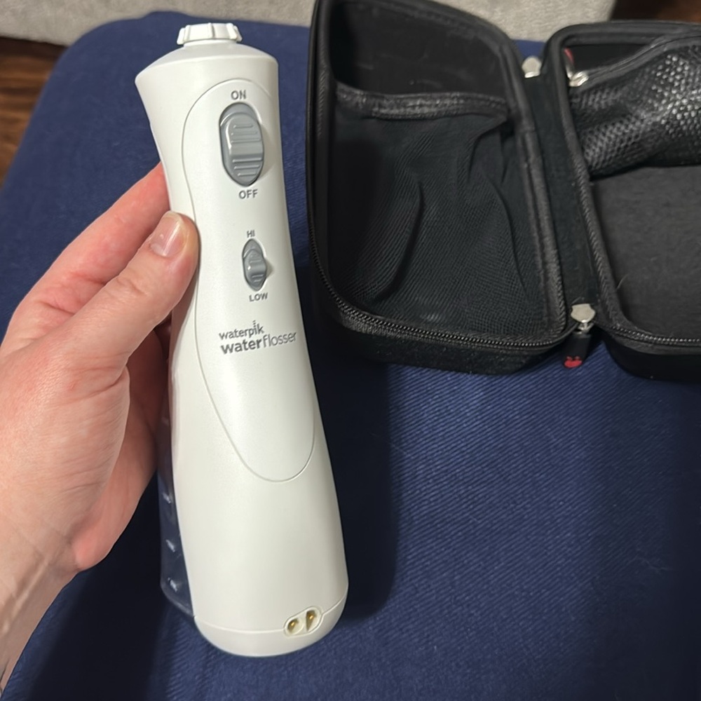 Portable White and Black waterpik with Case and charger